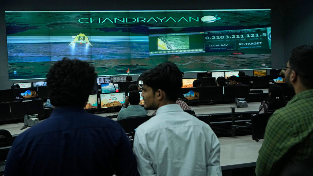 At the Integrated Command Control Centre in Varanasi, India, people look on as the country’s Chandrayaan-3 mission approaches the surface of the moon on August 23.