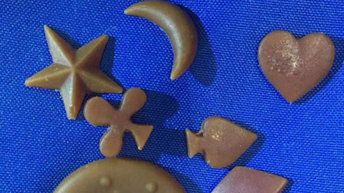 interesting scientific papers 2021 Pieces of soap made from plastic waste are displayed against a blue background. The soap has the color and reflectiveness of beeswax and is cut in various shapes, including a star, a moon and playing card suits.