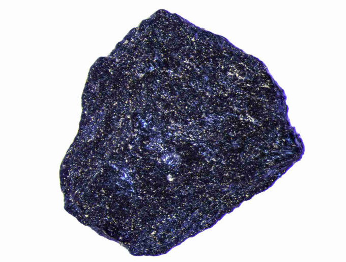 A sample of a material made of lutetium, nitrogen and hydrogen appears blue and sparkly in a composite microscope image.