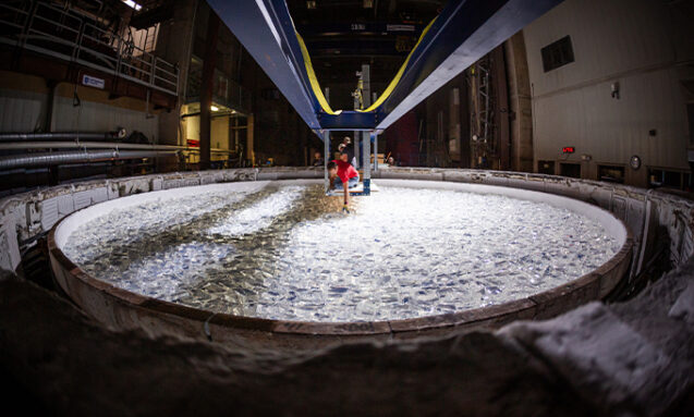 A photo of a giant spinning furnace holding nearly 17,500 kilograms of pure borosilicate glass for the Giant Magellan Telescope.