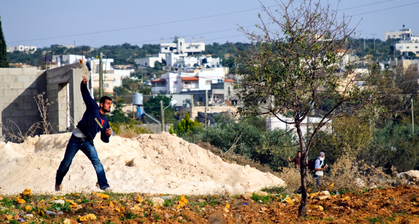 man throwing stone