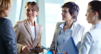 businesswomen talking