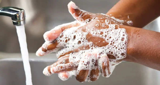 person washing hands