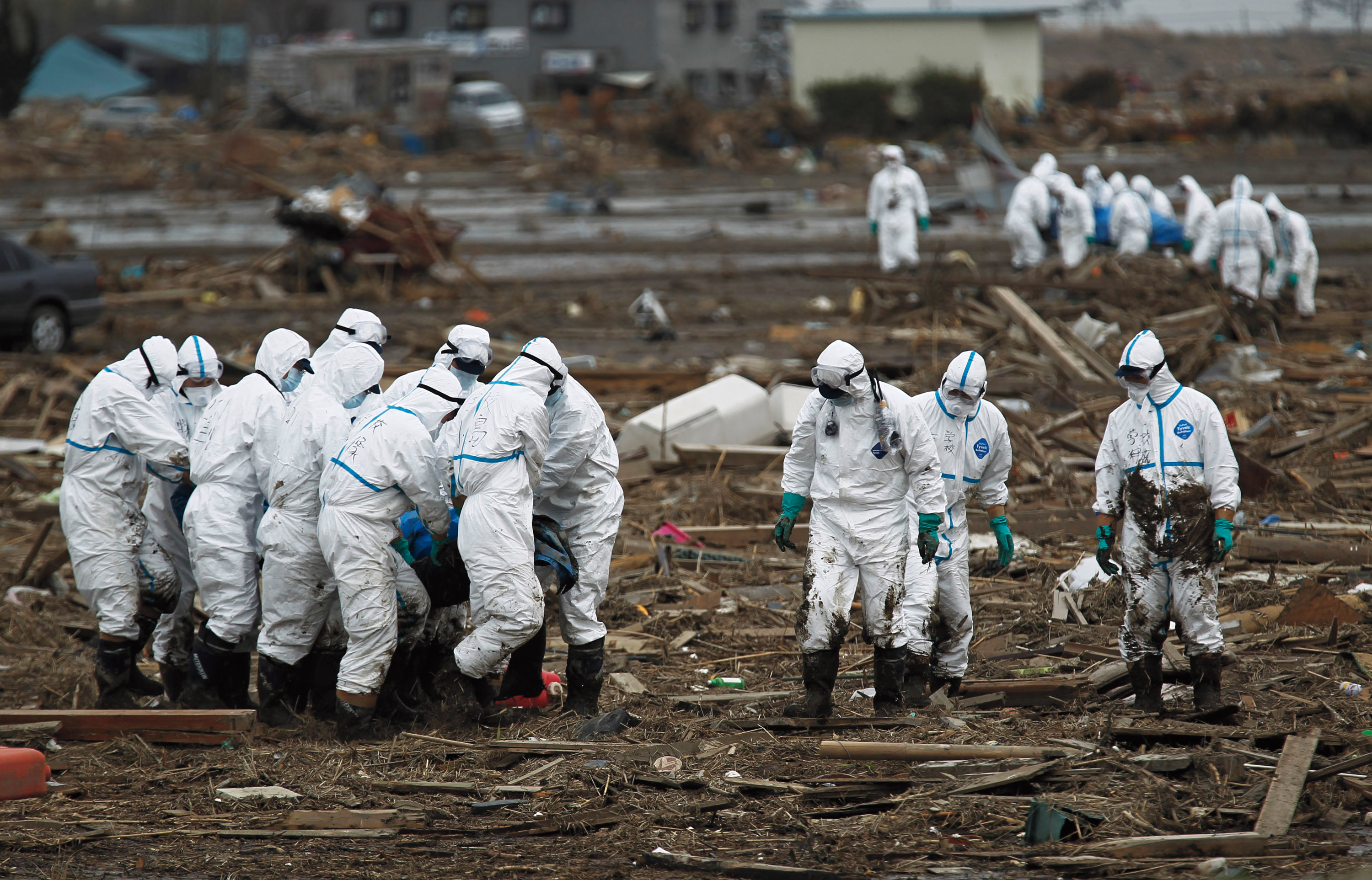 Japanese police and soldiers in radiation protective gear