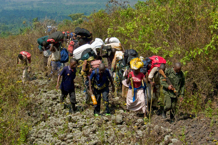 Porters carrying supplies up Mount Nyiragongo