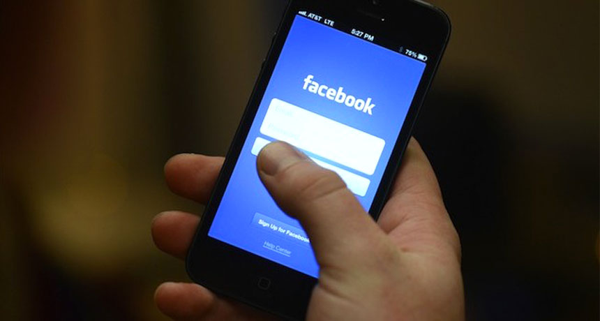 cell phone showing facebook app