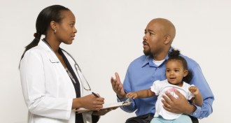 doctor talking to a father