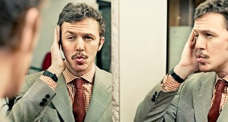 man looking in mirror