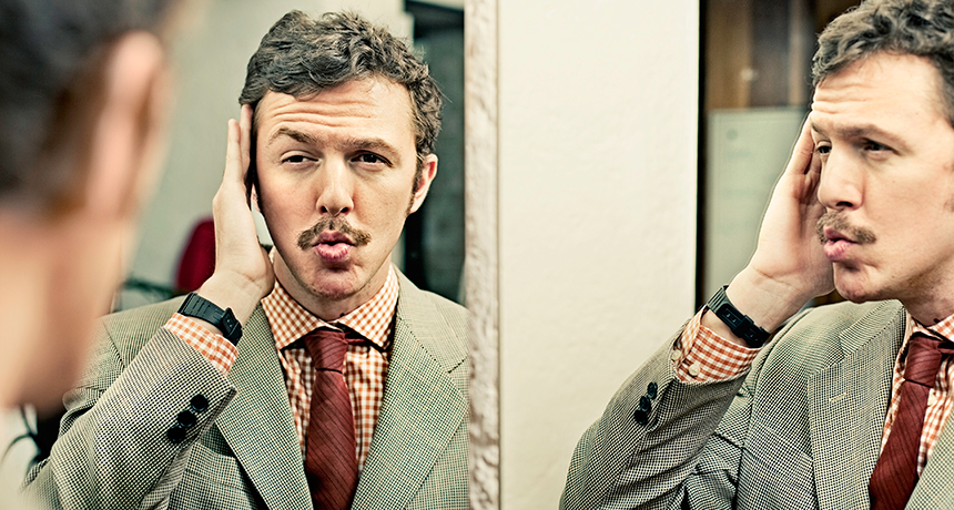 man looking in mirror