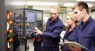 male engineer showing tutoring man and woman