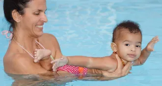 woman and baby in the pool