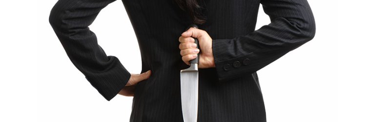 woman holding knife behind her back