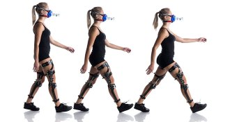 person walking with robotic leg braces