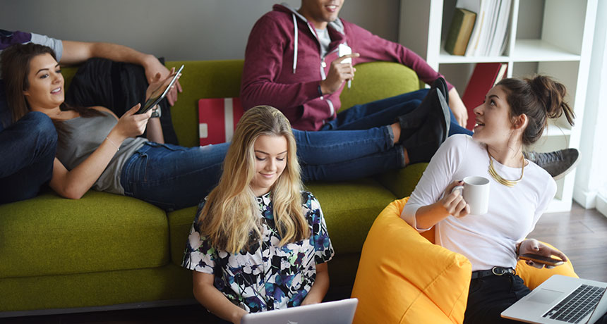 teens chatting and working on computers