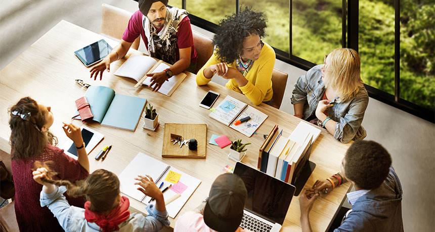 students studying around a table