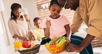 family making a meal at home
