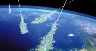 illustration of cosmic rays showering Earth