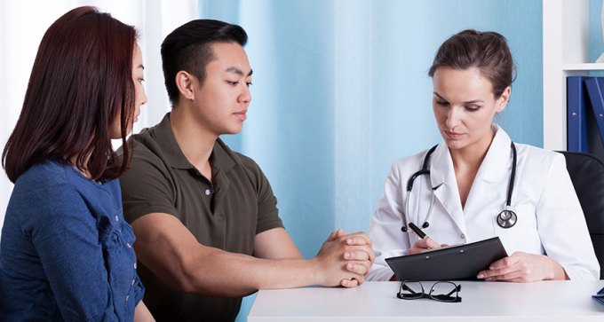 couple talking to doctor