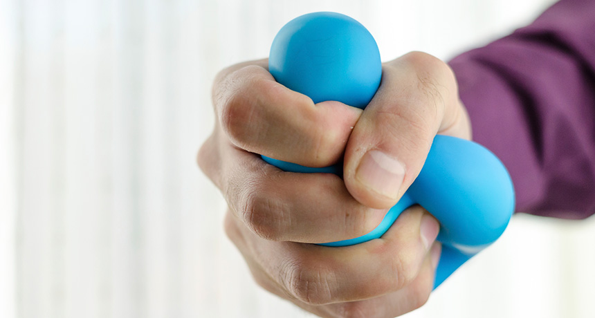 hand squeezing stress ball