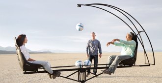 people throwing a ball on a carousel