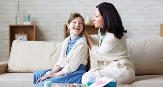 Mom talking to her daughter