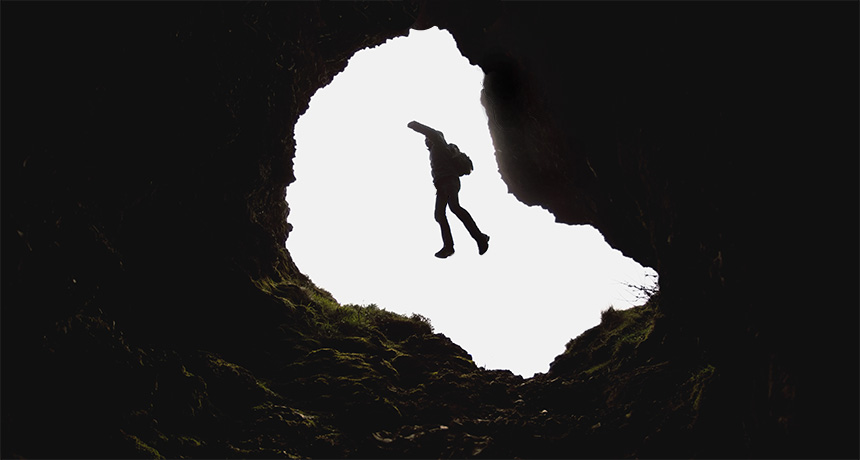 person falling through tunnel