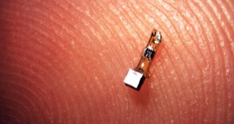 tiny crystal on a fingertip