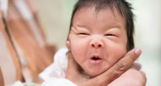 infant getting burped