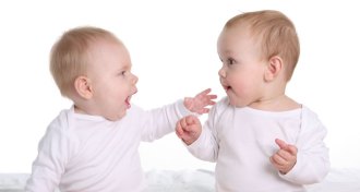 two babies chatting