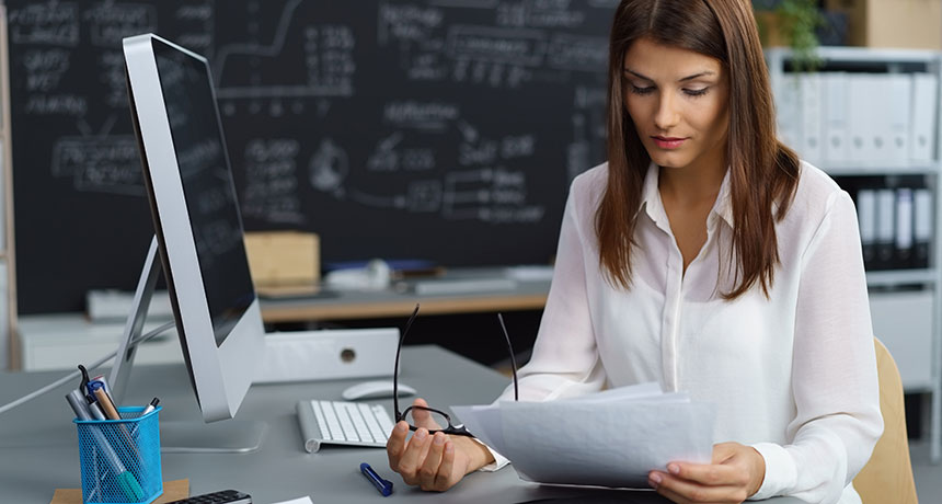 woman scientist reading an article
