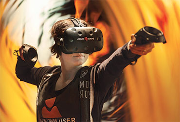 Lady playing a VR game