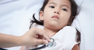 child in hospital bed