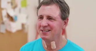 man with sensors on neck