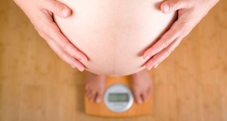 pregnant woman on scale