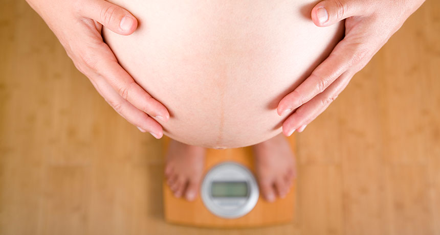 pregnant woman on scale