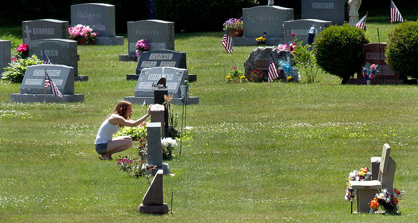 woman visiting grave