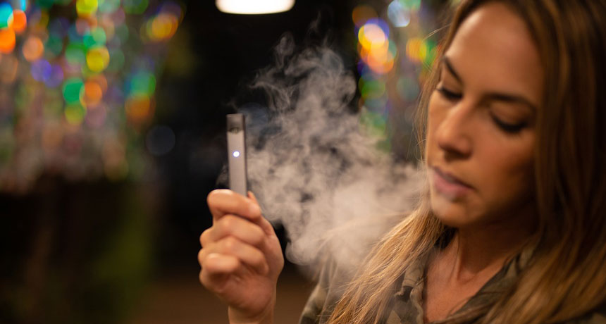 person using an e-cigarette