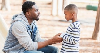 parent talking to kid in time out