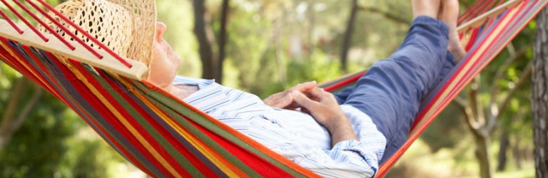 person snoozing in a hammock