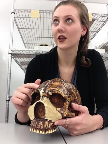 a photo of Kimberly Foecke holding a Neandertal skull