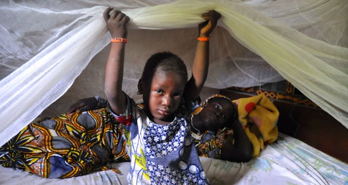 kids with mosquito bed nets