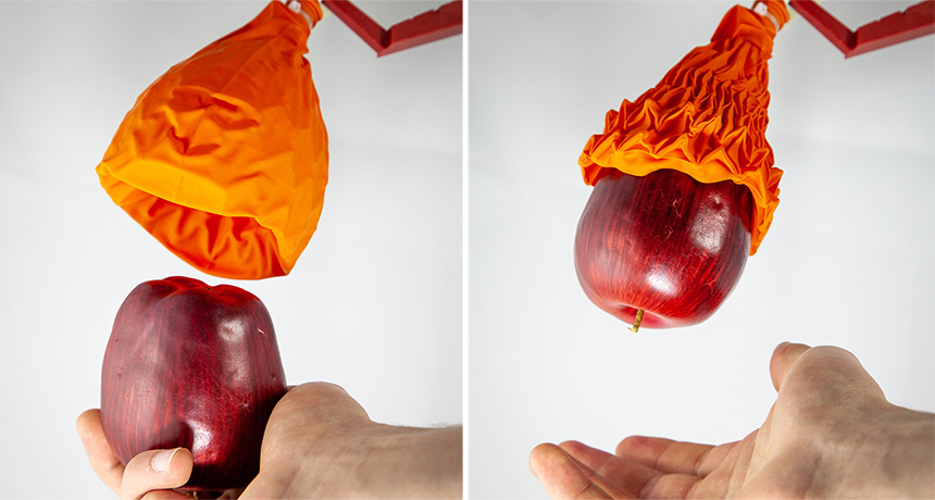 robotic gripper grabbing an apple
