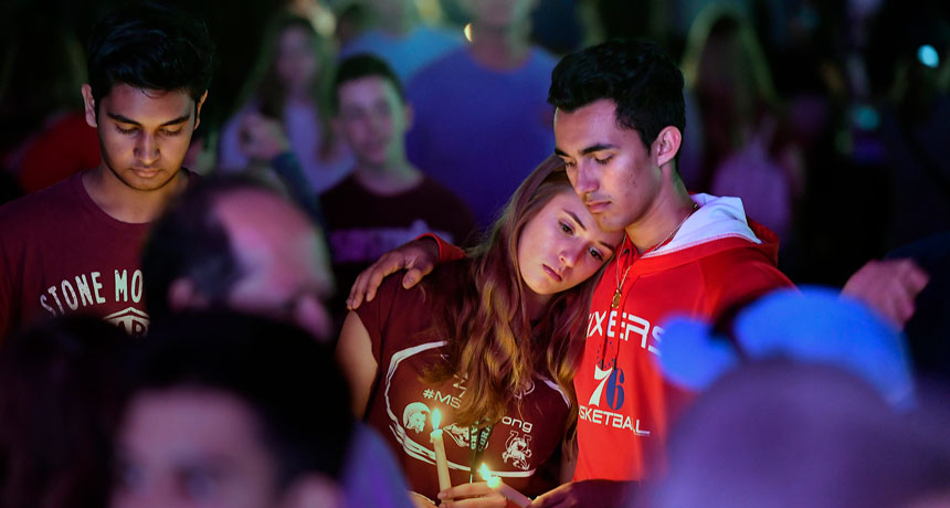 a group of students at a memorial in Parkland, Fla.