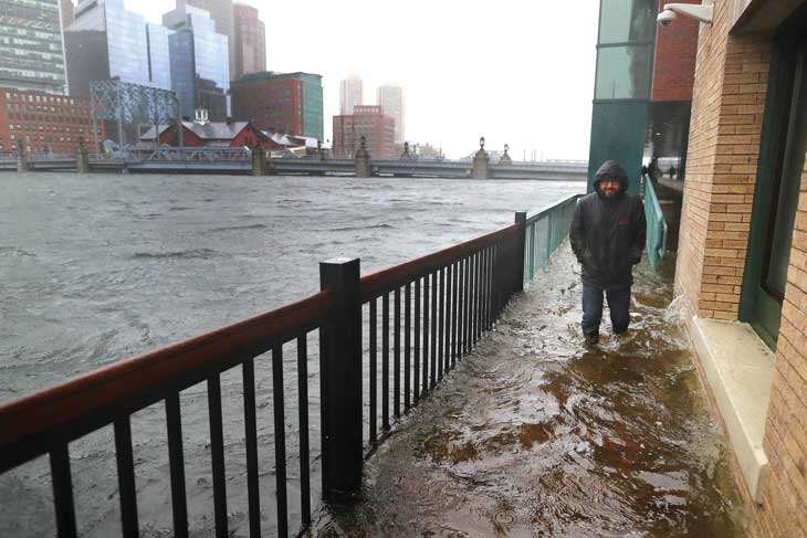 man on flooded street