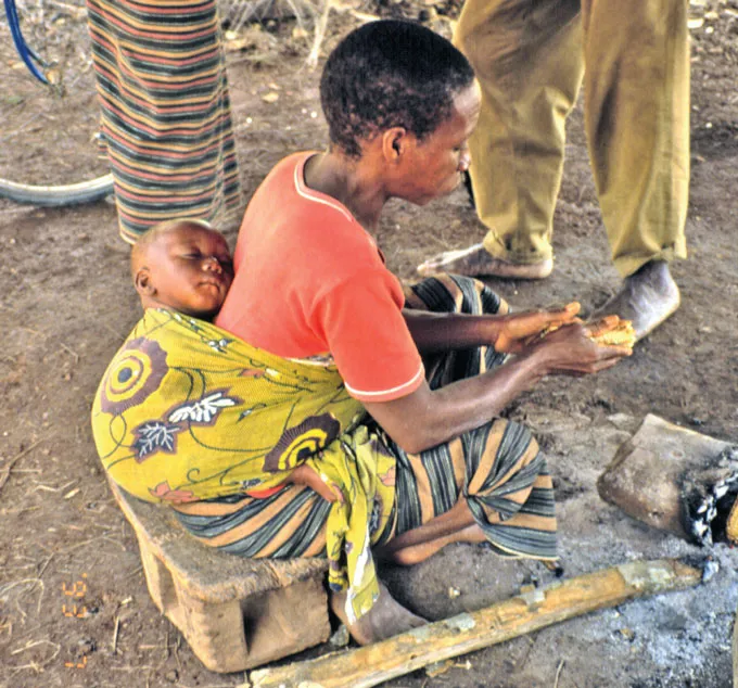 Beng mother carrying child