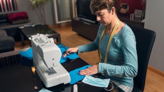 woman sewing masks