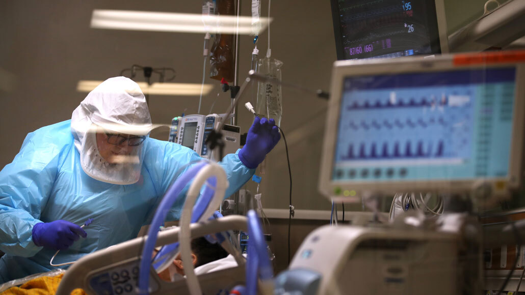 nurse with COVID-19 patient