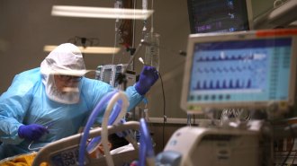 nurse with COVID-19 patient