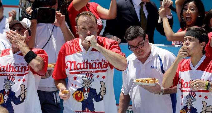 Joey Chestnut eating hot dogs at the 2019 Nathan's Famous Hot Dog Eating Contest