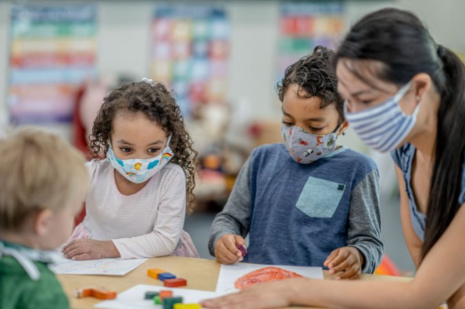 young children wearing masks in school due to COVID-19